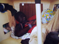 Robert with a globe in the berth where both of them sleep. He didn't think that the world looked like that.